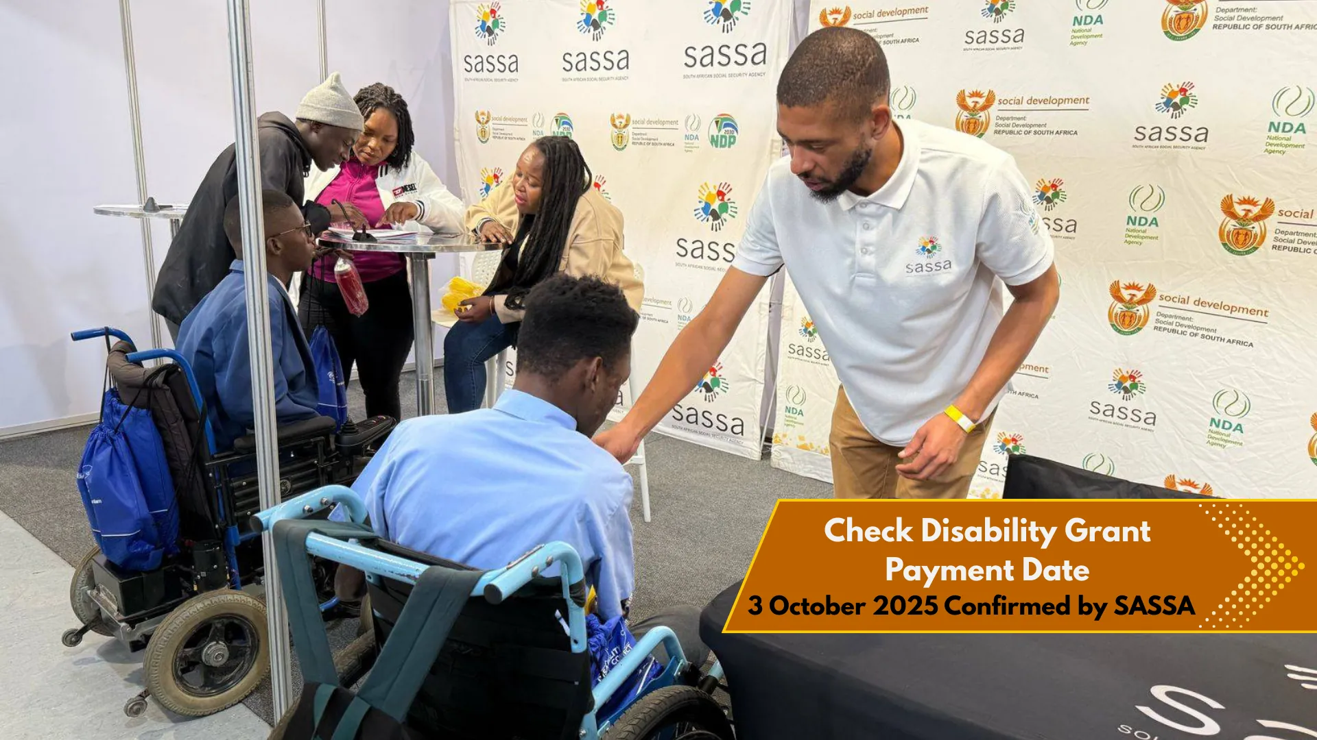 Disabled person at SASSA office help desk for grant inquiry, 3 October 2025 Confirmed as Disability Grant Payment Date by SASSA