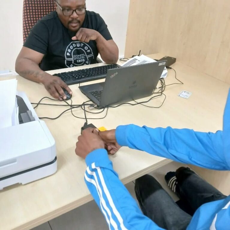 SASSA officer completing a beneficiary’s biometric verification at the SASSA office, SRD R370 Biometric Verification Now Mandatory for September 2025